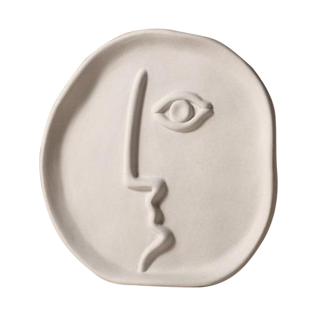 Jarrones de cerámica blanca con diseño de rostro humano y tallos de flores. El 18.5x18.5cm