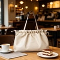 thumbnail image 4 of Women's Faux Leather Oversized Drawstring Pouch Tote, 4 of 5