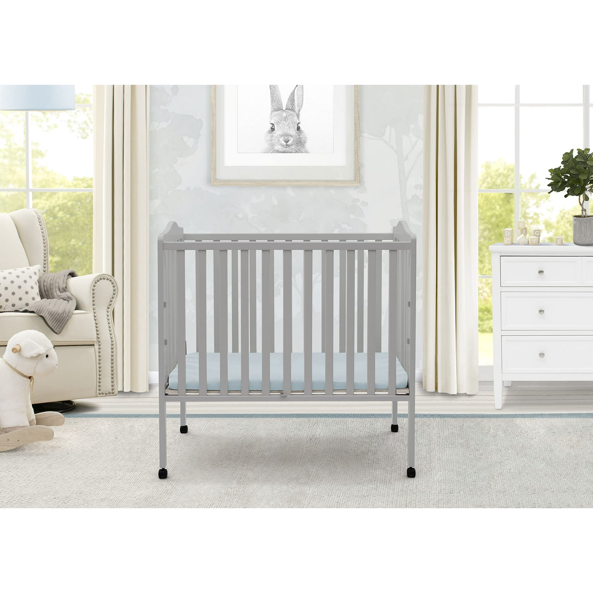 Mini crib folding hot sale