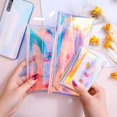 thumbnail image 1 of Monedero láser estilo ins, bolso de cosméticos para mujer, bolsa de almacenamiento de cable de datos, bolso de niña suave colorido azul claro, 1 of 5