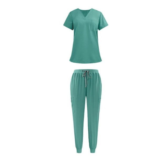 Las mujeres friegan el conjunto del uniforme del paño y los pantalones del trabajo para el peluquero del animal doméstico de la atención Verde