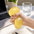 thumbnail image 3 of Transparent Coconut Oil Squishy Stress Ball with Slow Rising Design, Single Piece, Orange-Yellow, for Relaxation and Relaxation, Squeeze Toy, 3 of 3