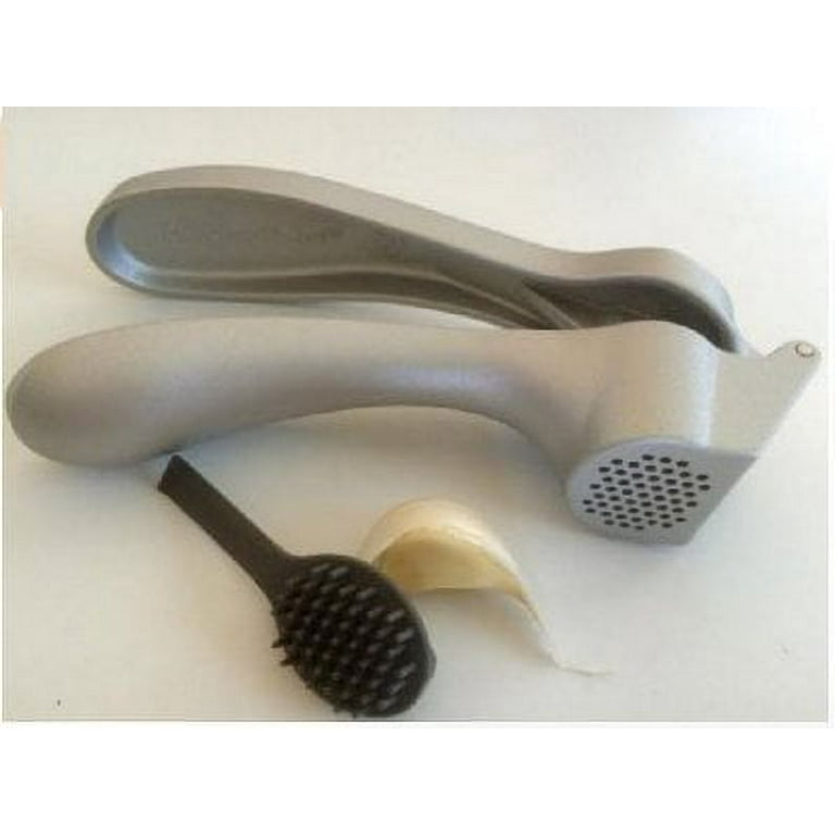 Old style cleaning tool, but still same great garlic press. Huge savings on  this. www.Pamperedchef.biz/carolc