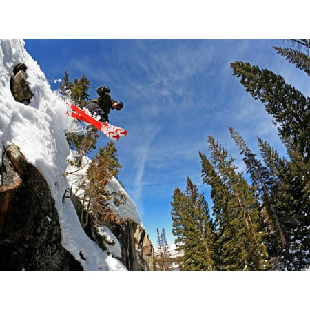 Skier Jumping Off Small Cliff at Brighton Ski Resort Print Wall Art By Paul