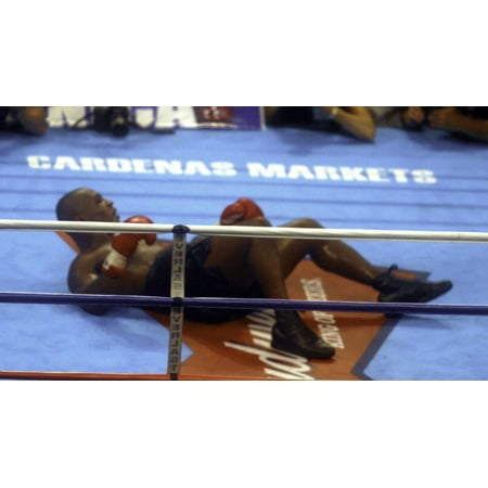 Mike Tyson lying down during his fight with Lennox Lewis Photo