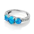 thumbnail image 3 of Gem Stone King 10K White Gold Blue Opal and White Lab Grown Diamond 3 Stone Engagement Ring for Women (1.67 Cttw, Oval Cabochon Gemstone October Birthstone, Available in Size 5, 6, 7, 8, 9), 3 of 5