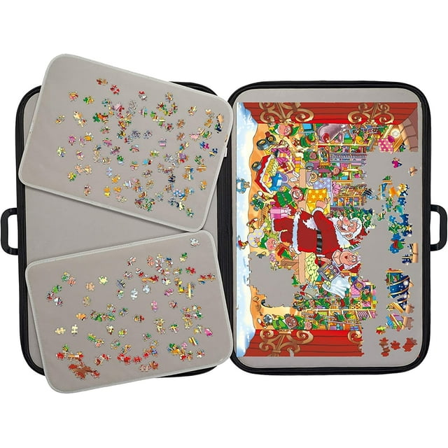 Tradeopia Black Portable Jigsaw Puzzle Storage Case for up to 1000 Pieces open showing a partially completed Christmas-themed puzzle with Santa Claus and elves on the right, two beige sorting trays with scattered puzzle pieces on the left, all inside a black zippered carrying case with handles, suitable for organizing and transporting puzzles.