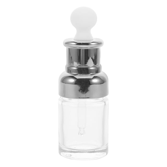 frasco gotero de vidrio para aceites esenciales, perfumes, sueros, frasco cosmético rellenable — vista frontal centrada de un frasco de 30 ml con cuerpo de vidrio transparente, cuello y tapa plateada y pipeta de silicona blanca. Diseño moderno y dispensación precisa; adecuado para sueros, aceites esenciales y muestras, y a menudo usado como frasco de viaje o muestra profesional.