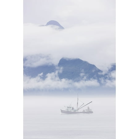 Commercial fishing boat Silver salmon fishing outside of Valdez small boat harbor with misty clouds and mountains in background Prince William Sound Southcentral Alaska USA Canvas Art - Kevin Smith 