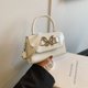 thumbnail image 1 of Bolso de mano de textura suave coreano de moda popular de este año, nuevo bolso bandolera cuadrado pequeño versátil de primavera 2025, 1 of 5