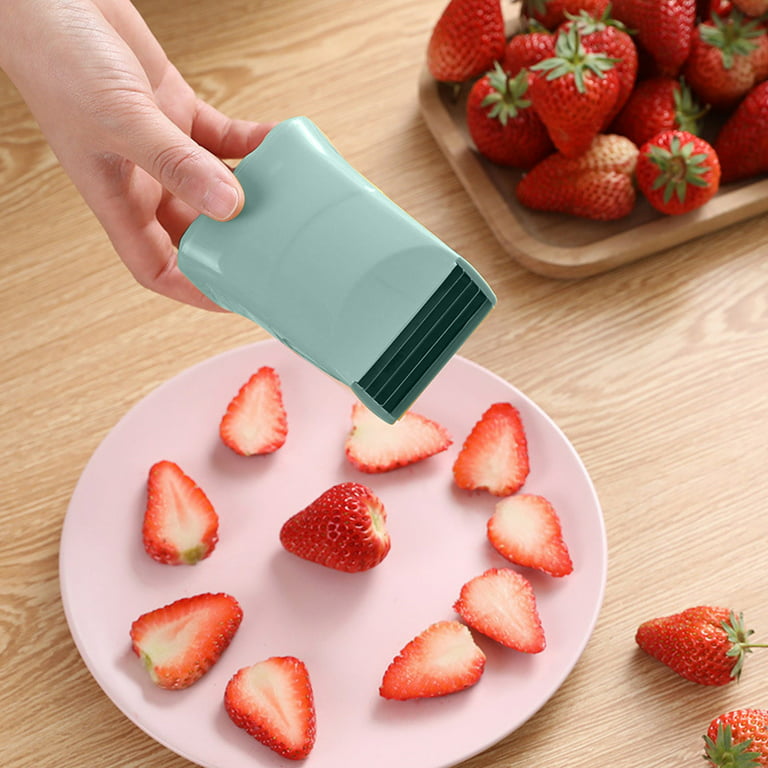 The Pampered Chef Cup Slicer cutting fresh strawberries 