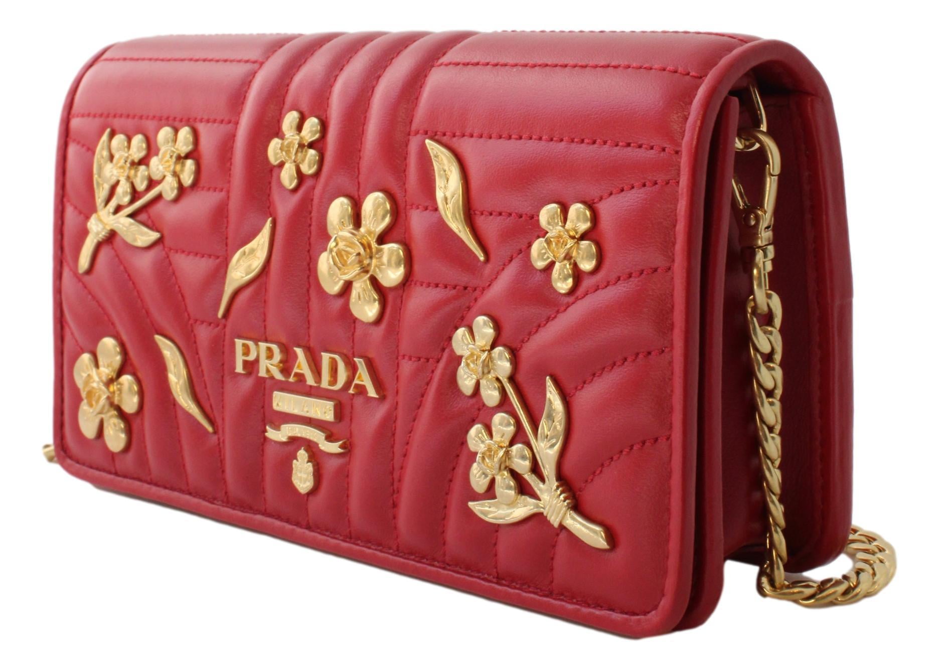 Prada wallet on gold chain. Patterned maxi skirt. Red nails.