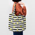 thumbnail image 4 of Xecao's Lemon_1 Canvas Tote Bag is a versatile choice for women, serving as a stylish beach bag, shopping bag,and reusable grocery bag., 4 of 5