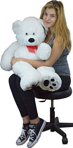 white teddy bear with red ribbon