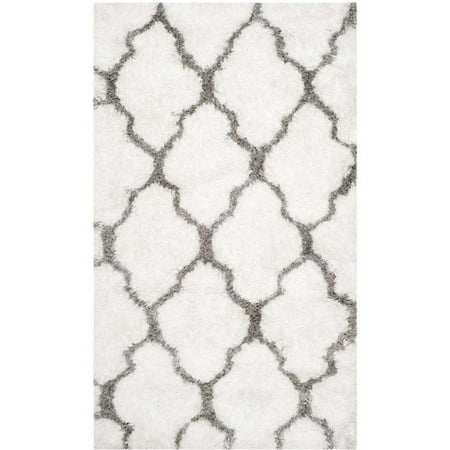 Safavieh Barcelona Shag White Shag Rug - Runner 2 3  x 4 Safavieh celebrates the fiber artists of New England with the Barcelona Shag collection of cotton pile rugs. Hand-tufted in India to create the stunning look of fine art that’s crafted of textiles and natural fiber yarns  Barcelona Shag rugs are brilliant Features: Color: White / Silver Material: 80% Polyester. 20% Cotton Weave: Hand Tufted Shape: Runner Design: Shag Collection: Barcelona Shag Specifications: Rug Size: Runner 2 3  x 4