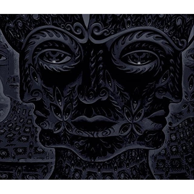 cd tool 10,000 days completamente nuevo CD a estrenar RCA Records. Portada frontal centrada de un rostro humano estilizado y simétrico en tonos gris oscuro y negro con motivos ornamentales tallados y textura labrada, formato cuadrado, indicado como álbum musical.