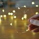 thumbnail image 4 of Guirnalda de luces LED de 50 LED, guirnalda de luces decorativas alimentadas por batería, alambre de cobre para dormitorio, boda (16 pies/5 m, blanco cálido) Ormromra SNFLD382, 4 of 8