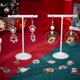 thumbnail image 4 of 1 caja de 48 dijes navideños de esmalte plateado, con forma de árbol de Navidad, copo de nieve, calcetines de Papá Noel, campanas y colgantes de nieve., 4 of 9