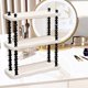 thumbnail image 4 of Estantería organizadora de escritorio | Estante de almacenamiento multinivel | Marco de plástico amarillo crema y varillas de metal negro | Diseño de estantería abierta para tazas cosméticos, 4 of 7