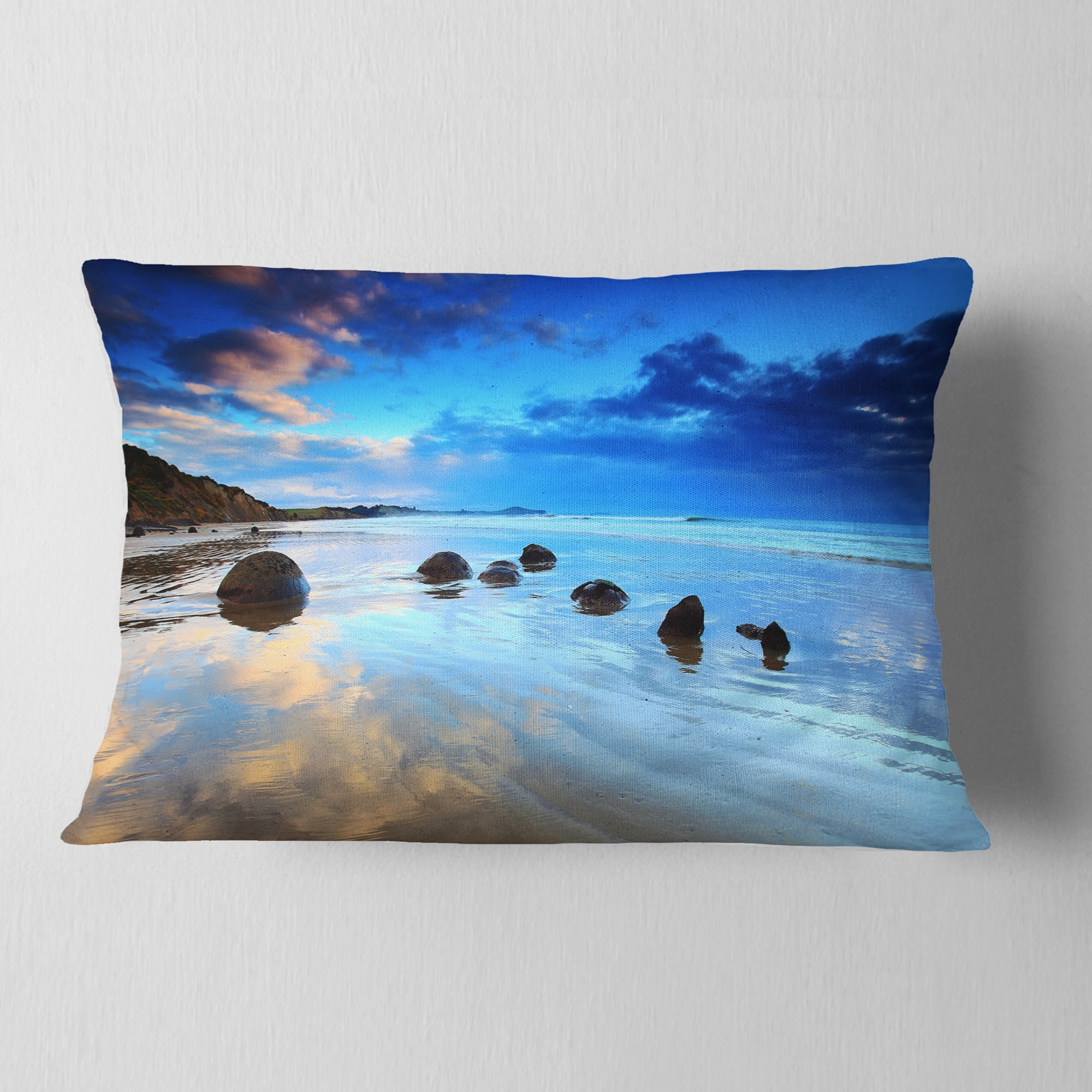 Designart Moeraki Boulders Under Cloudy Sky - Seashore Photo Throw Pillow - 12x20