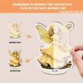 thumbnail image 3 of Rotating acrylic ornament featuring an angelic figure in a pastel yellow dress with iridescent wings holding a golden harp surrounded by ornate bowls, 3 of 6