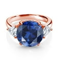 thumbnail image 2 of Gem Stone King 18K Rose Gold Plated Silver Blue Simulated Sapphire and White Moissanite 3-Stone Ring for Women (6.94 Cttw, Round 12MM, Trillion 5MM, Size 5), 2 of 3