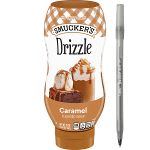 Smucker’s Drizzle Caramel Flavored Syrup with pen