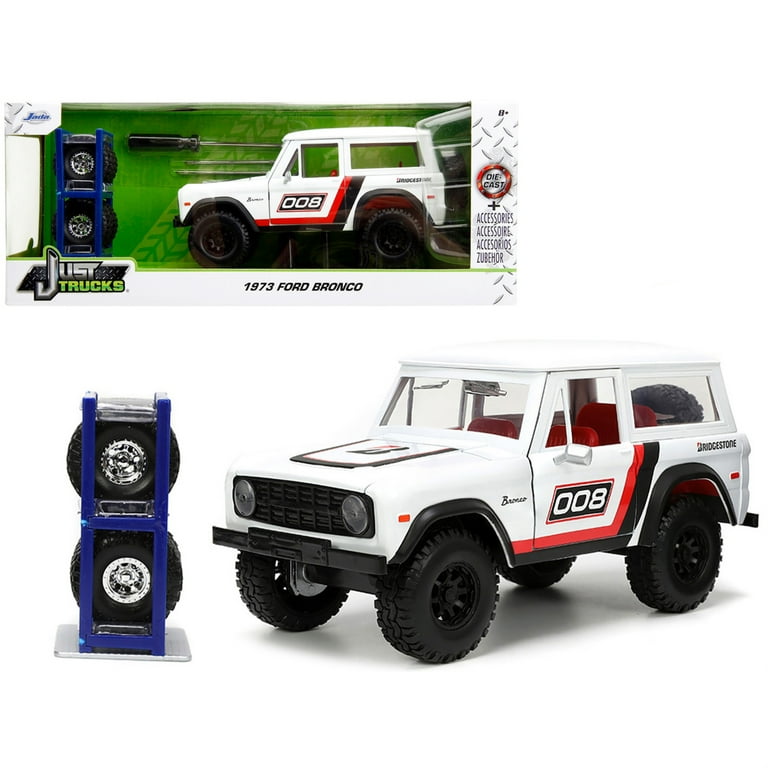 1973 Ford Bronco #008 White with Red and Black Stripes and Red Interior with Extra Wheels Just Trucks Series 1/24 Diecast Model Car by Jada 1973 Ford Bronco #008 White with Red and Black Stripes and Red Interior with Extra Wheels Just Trucks Series 1/24 Diecast Model Car by Jada