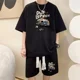 thumbnail image 2 of Chándal informal de moda de gran tamaño de verano, traje holgado para correr con diseño de gofre, camiseta holgada de manga corta y pantalones cortos deportivos, conjunto de 2 piezas para hombre, 2 of 5