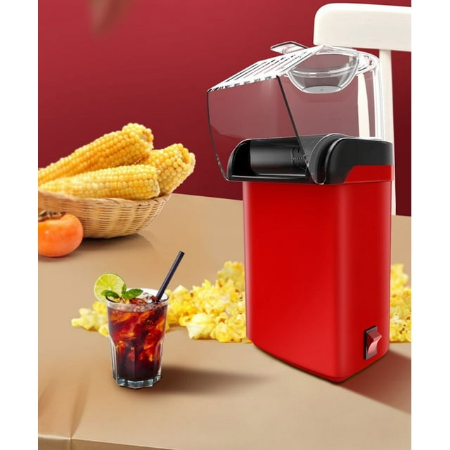Home electric popcorn maker with measuring cup for portioning kernels and melting butter