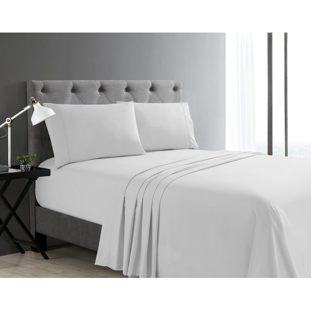 White Swift Home Basic 4-piece queen size sheet set displayed on a bed with gray tufted headboard, featuring ultra soft fabric and deep pockets.
