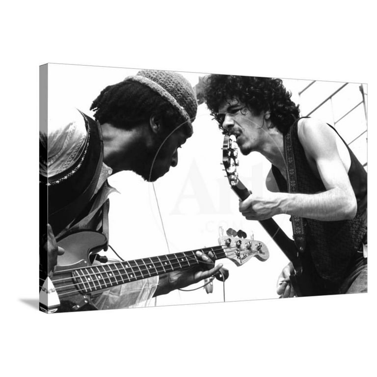 Guitarists David Brown And Carlos Santana During Music And Art Festival In  Woodstock, August 1969, Stretched Canvas Wall Art Sold by Art.Com 