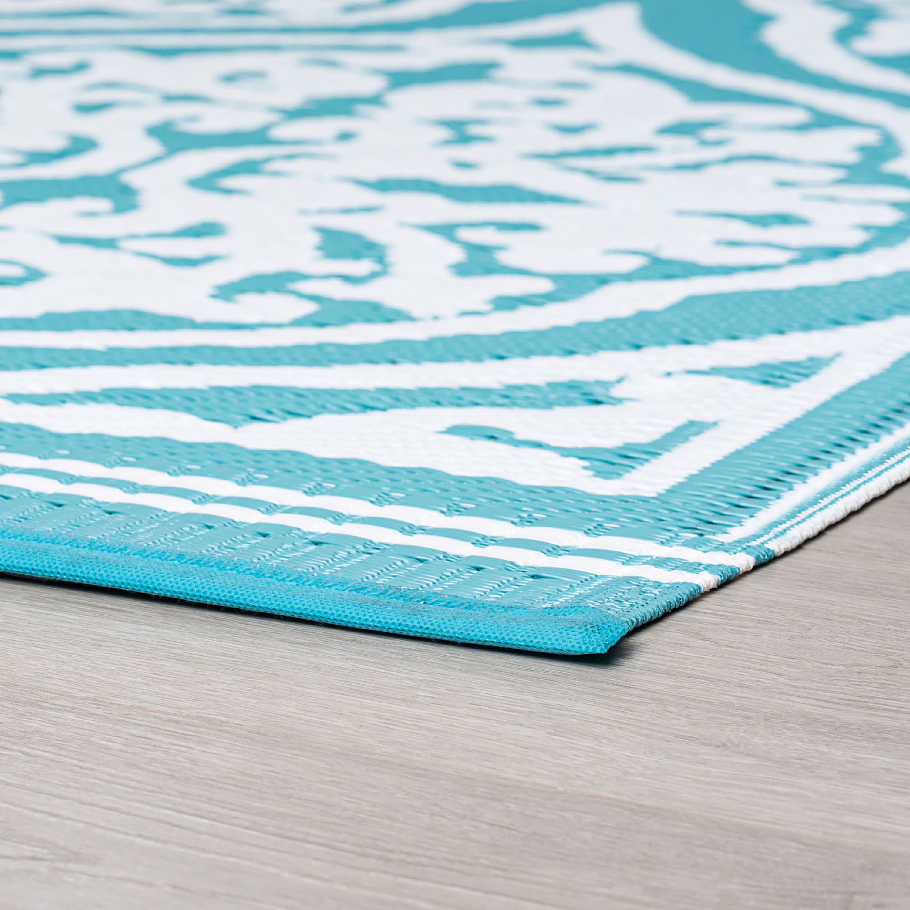 5x7 Reversible Aqua and White Polypropylene Outdoor Damask Area Rug