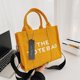 thumbnail image 1 of Bolso de lona cruzado de gran capacidad con letras de color sólido, bolso de mano portátil para mujer simple, 1 of 5