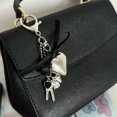 thumbnail image 2 of Charming Keychain: Features a Shiny Silver Heart and a Sweet Bow Detail, 2 of 9