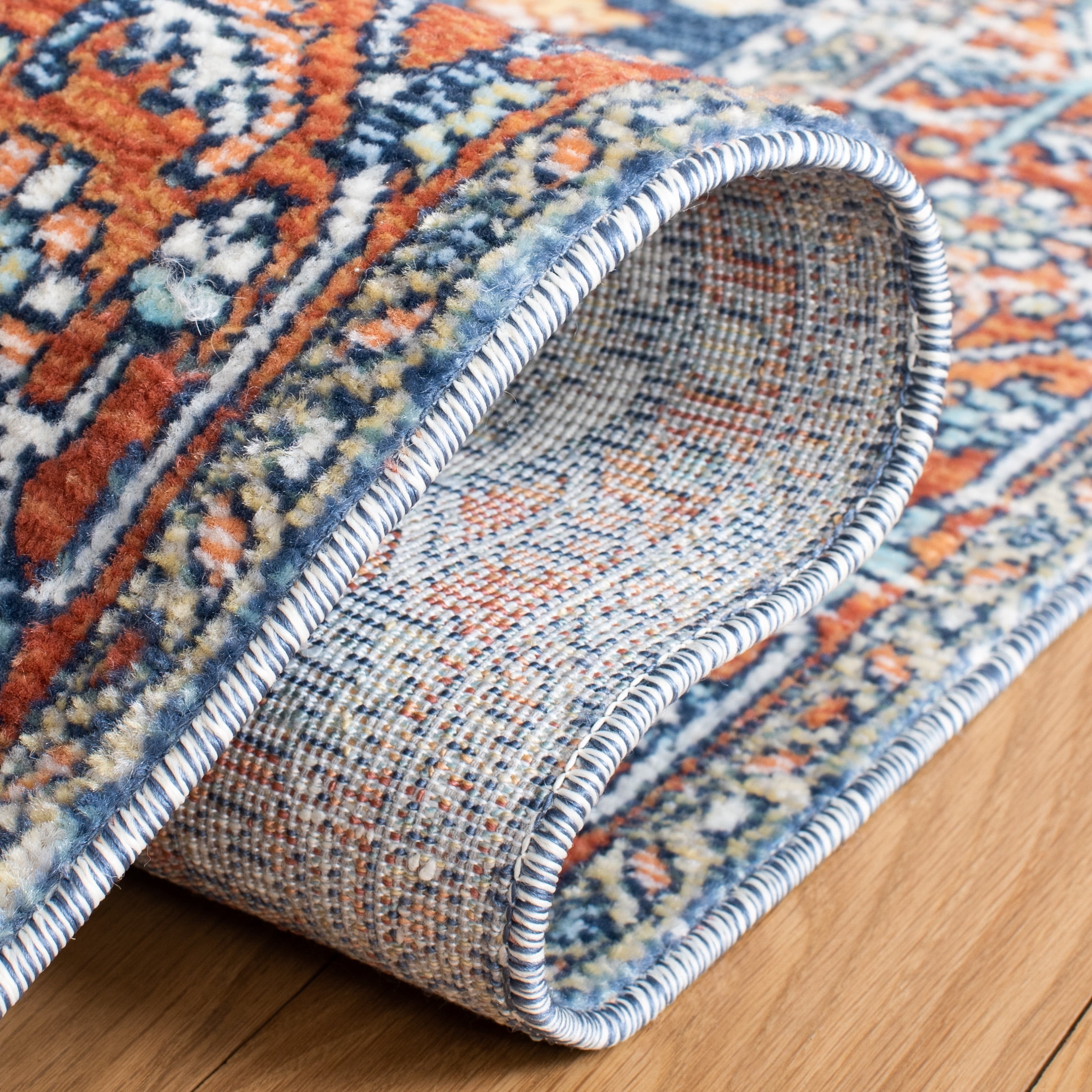SAFAVIEH Aria Gligor Oriental Area Rug, Navy/Rust, 5'3" x 7'7"