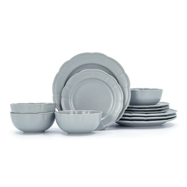 Blue scalloped 12-piece dinnerware set with plates and bowls displayed against a white background.