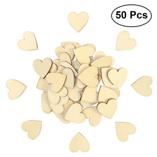 Premium Photo  Heart shape made of small wooden hearts