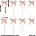 thumbnail image 3 of Contenido del paquete: Incluye un juego de decoraciones para cupcakes con forma de lazo, que agregarán encanto a su fiesta de cumpleaños o boda con temática de mariposas., 3 of 8