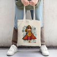 thumbnail image 2 of Stylish Canvas Tote Bag with Vibrant Illustration of Woman in Dress & Cape Artistic Text Design Perfect for Shopping & Travel, 2 of 4