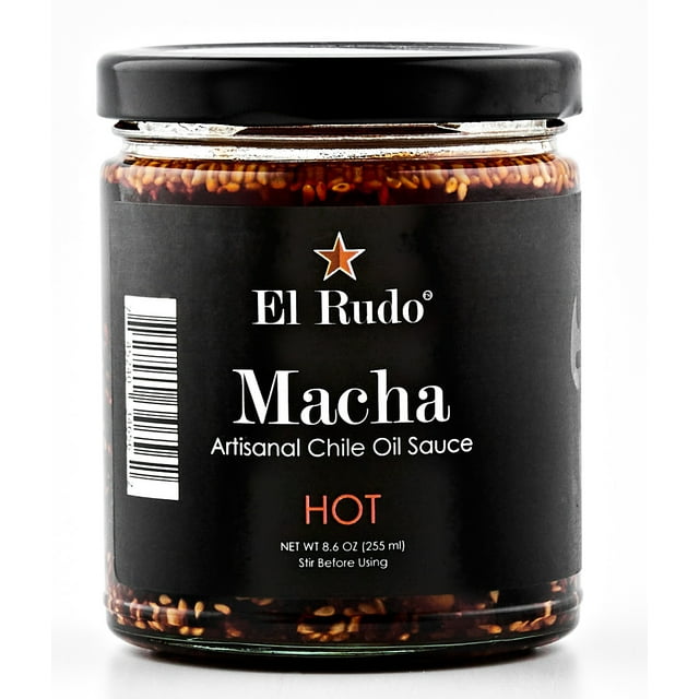 El Rudo Salsa Macha - Chili Oil Sauce - Hot Sauce (Single-Pack), an 8.6 oz glass jar with a black label featuring 'Macha Artisanal Chile Oil Sauce' and 'Hot' in bold red text. The jar highlights a handcrafted blend of sesame seeds, dried chiles, and spices, ideal as a spicy condiment for tacos, noodles, or pizza.