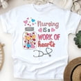 thumbnail image 1 of T-Shirt Graphique « Nursing is a Work of Hearts » pour Femmes, Blanc, Taille 2TG, 1 of 6