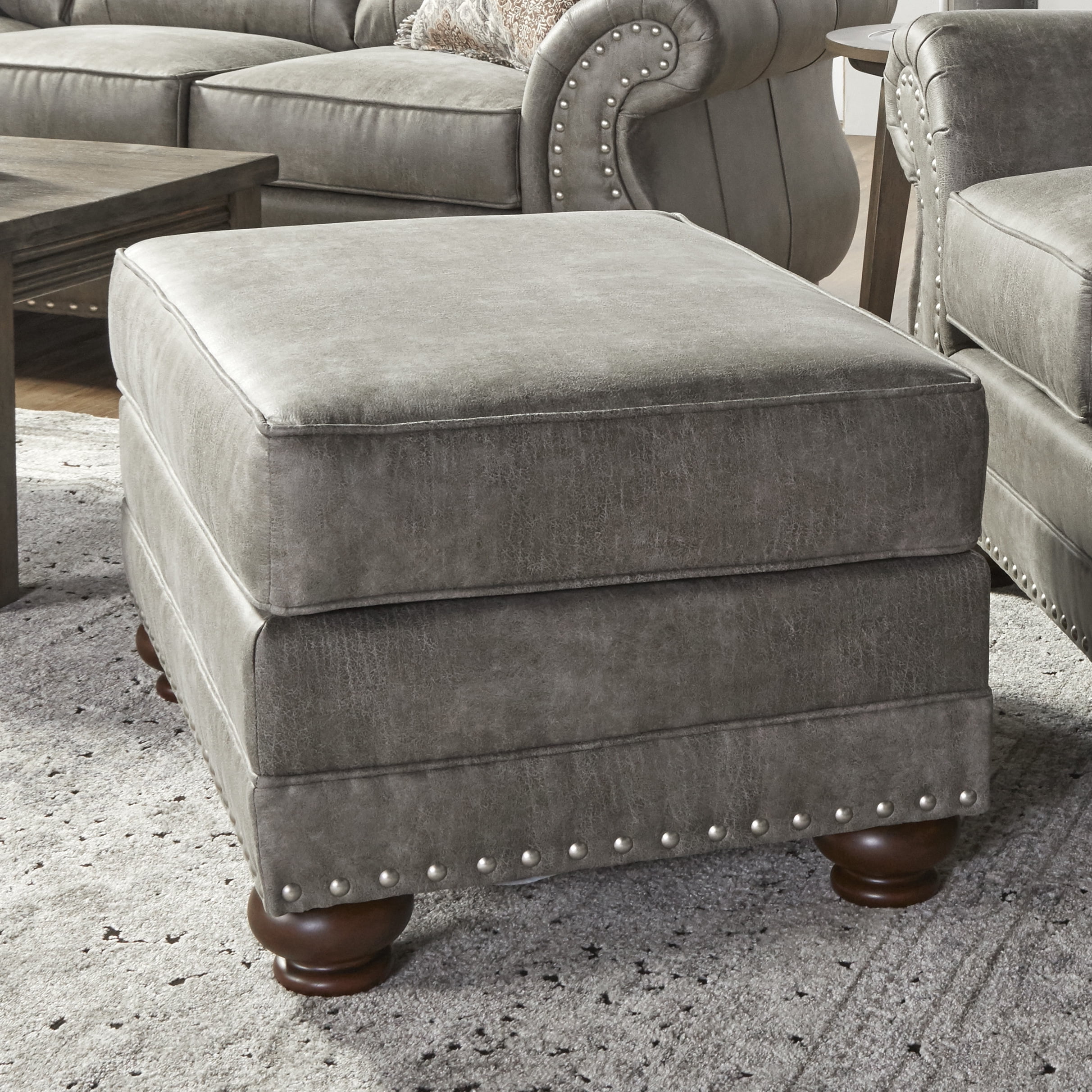 Roundhill Leinster Faux Leather Upholstered Nailhead Ottoman in Stone