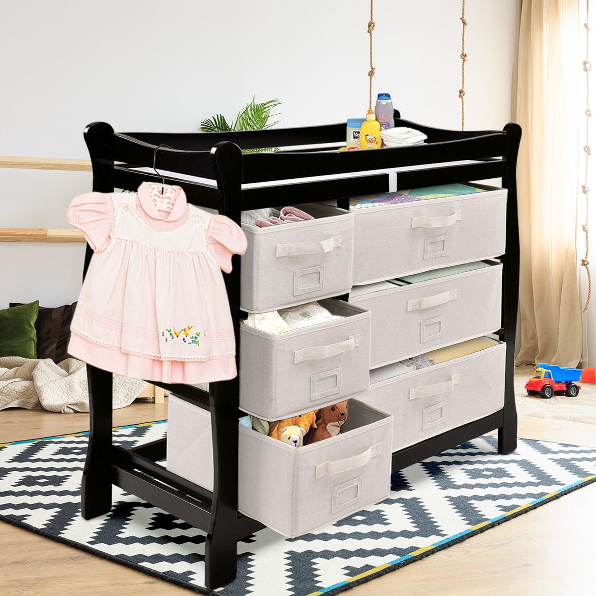 sleigh style baby changing table with 6 storage baskets and pad