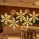 thumbnail image 1 of Luces navideñas para ventana con ventosa | Árbol de copos de nieve con luces LED a pilas | Decoración navideña de interior en blanco cálido para dormitorio y exposición, 1 of 5