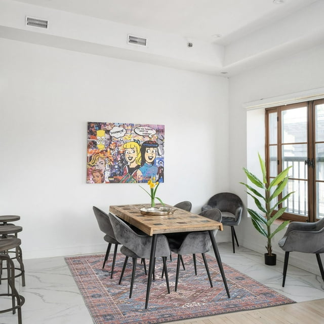 ECARPET Vintage Turkish flatweave indoor area rug from the Afshar Collection featuring eco-friendly, machine washable material beneath a wooden dining table and gray chairs in a bright, modern room.