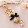 thumbnail image 2 of Llaveros con colgante de perlas para mujer, llavero de carro de calabaza, joyería de lujo, lazo de coche, decoración de bolso de Camelia, 2 of 4