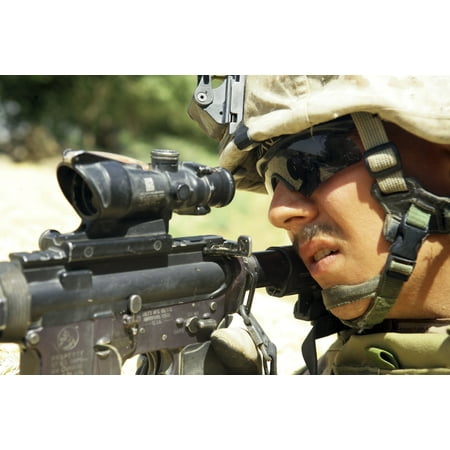 US Marine providing security with rifle during a patrol in Helmand province Afghanistan Canvas Art - Stocktrek Images (34 x