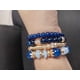 thumbnail image 3 of Set de 4 pulseras en colores azul rey, varios modelos con dije, 3 of 7