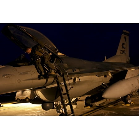 - LAMINATED POSTER A U.S. Air Force F-16 Fighting Falcon pilot readies his jet for a training mission early in the morn Poster Print 24 x 36